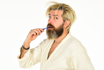 Stay healthy. Keep teeth healthy. Brush teeth. Morning routine. Oral hygiene. Mature man in bathrobe hold toothbrush. Personal hygiene. Bearded hipster cleaning teeth. Freshness and cleanliness