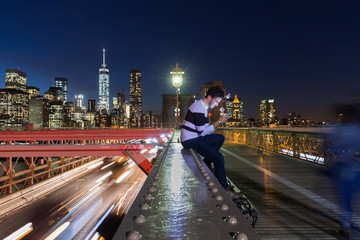 New York City - sunset over Manhattan from Brooklyn Bridge.