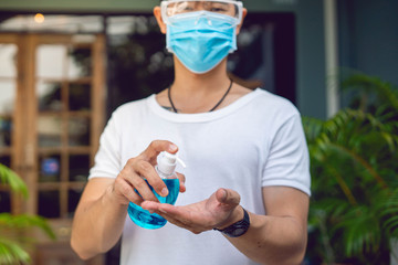 washing hands with alcohol gel to protect from corona virus or covid-19