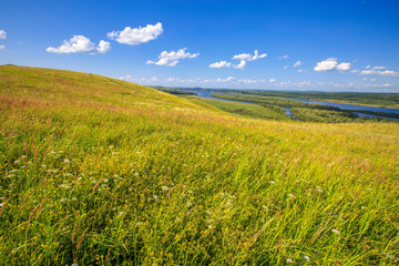 beautiful hills on the high bank of the river Vyatka on a sunny day in summer