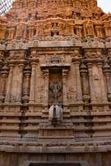 A beautiful picture of a Hindu idol in the wall of a temple in India
