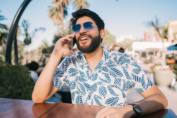 Young man talking on the phone.