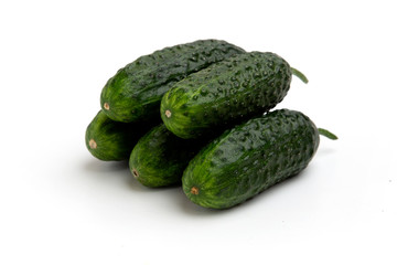 Bright green cucumbers whole isolated on a white background
