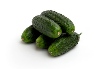 Bright green cucumbers whole isolated on a white background