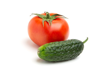 whole juicy bright red tomatoes with green cucumber isolated on a white background