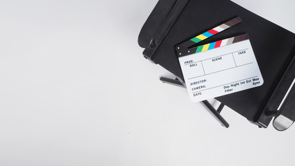 Clapper board or or movie slate with director chair.It put on white background. it is used in video...