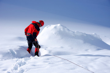 Fototapeta na wymiar Alpinist traversing Mensu Glacier in Altai Mountains, Russian Federation