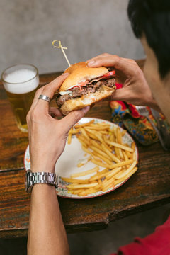 Man Eating Bacon beef burger