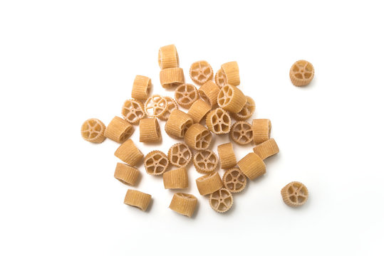 Closeup of gluten free pasta in shaped wheel on top view on white background