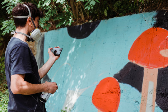 Graffiti artist painting