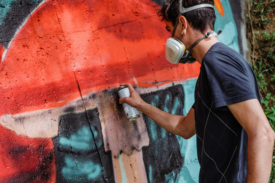 Graffiti artist painting