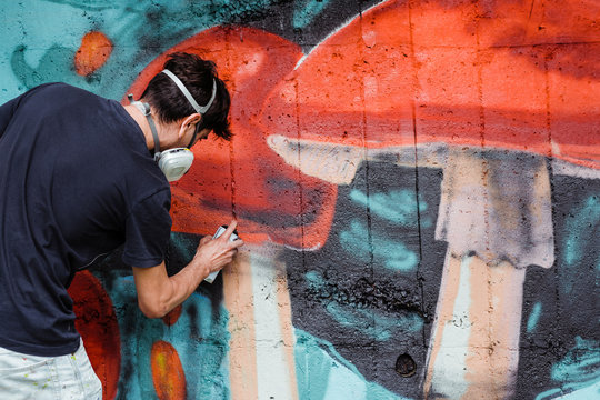 Graffiti artist painting