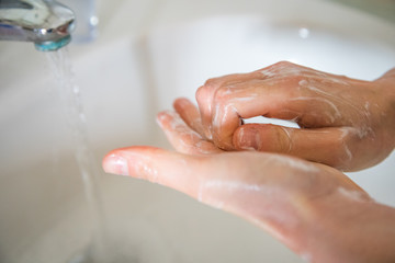 Washing hands rubbing with soap man for corona virus prevention, hygiene to stop spreading coronavirus.