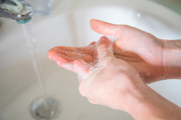 Washing hands rubbing with soap man for corona virus prevention, hygiene to stop spreading coronavirus.