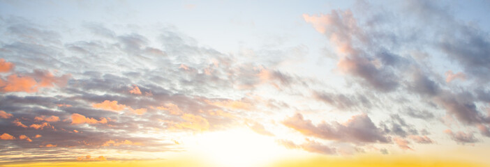 Blue sky clouds background. Beautiful landscape with clouds and orange sun on sky