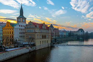 Cityscape of Prague and the Vltava River at sunrise, seen from the Charles Bridge, Czech Republic.