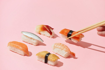 Close up of sushi with chopsticks