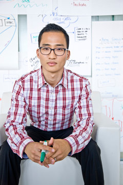 Portrait of businessman sitting in office