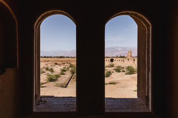 Interior of the caravanserai seen through two windows