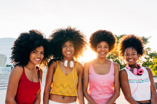 Afro women friends hanging out in the city