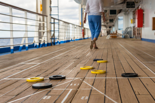 playing shuffleboard on a cruise