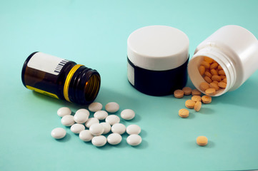 jars with pills on blue background