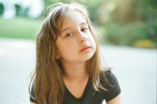 Portrait of a young girl looking at the camera intently
