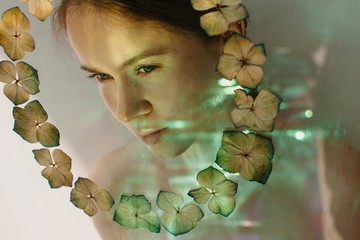 Surreal portrait of woman in floral frame