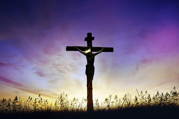Jesus Christ death on cross crucifixion on calvary hill at sunrise