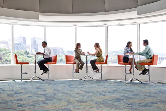 Business people working in office cafeteria