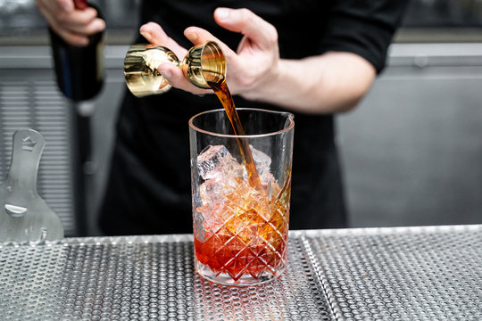 Bartender Making Whisky Cocktail