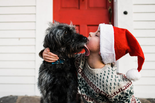 dog licking boy on Christmas Day