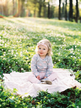 Child sitting on meadow