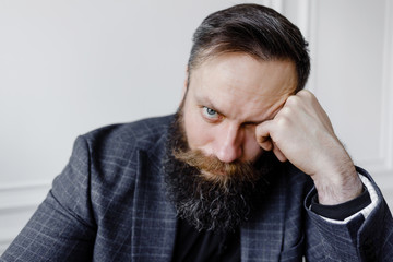 Close-up portrait of a sad businessman in a suit.
