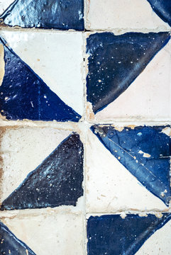 antique tiles in triangle shape, white and blue