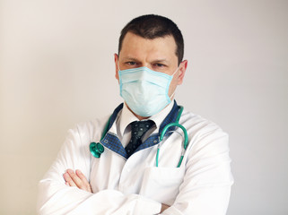 Doctor pediatrician wearing a protective mask against coronavirus. Banner panorama, medical staff, preventive equipment. Pandemic.  
Healthcare concept