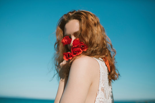 Woman With Red Flowers