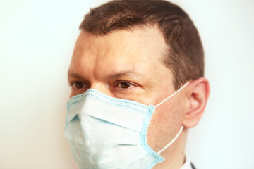 Doctor pediatrician wearing a protective mask against coronavirus. Banner panorama, medical staff, preventive equipment. Pandemic.  
Healthcare concept. Close-up
