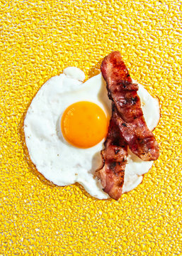 Close up of half fry omelet with bacon