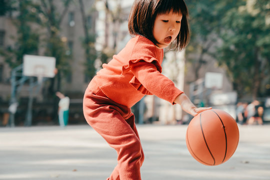 Child Playing Basketball Outdoor