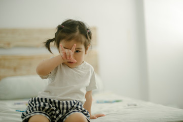 Little girl showing sign language for love