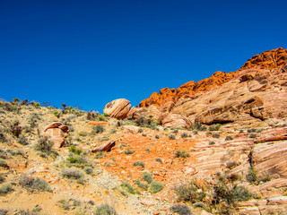 Fototapeta premium A canyon with a mountain in the background. Large brown slopes.