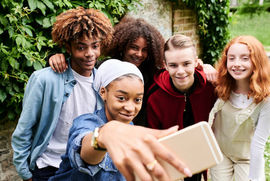 Multiracial group selfie.