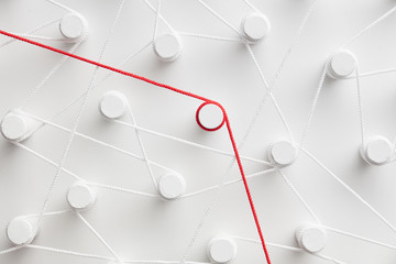 Isolated red thread among white threads