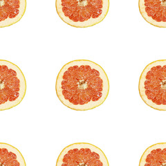 Seamless pattern of isolated slices of grapefruit. Wallpaper for background, design and packaging.