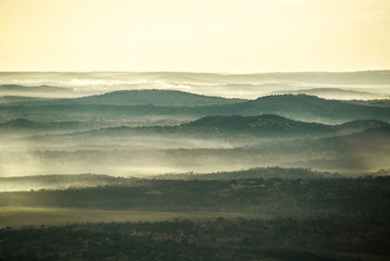 Obraz premium hazy morning light over mountain ridges in africa