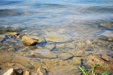
Riverbank with clear water and stones