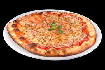 Tasty pizza margarita with tomato sauce, mozzarella, basil on a plate, isolated on black background