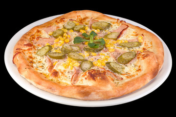 Tasty pizza with cream sauce, pickles, bacon and corn on a plate, isolated on black background