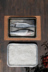 Sea bass in salt, typical Mediterranean dish on baked tray